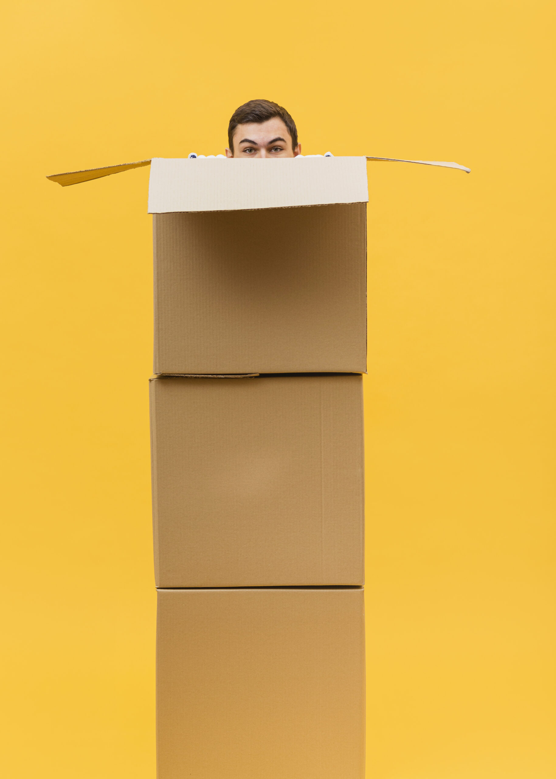 delivery-man-hiding-behing-packages
